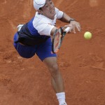 
              Japan's Kei Nishikori returns in the first round match of the French Open tennis tournament against Paul-Henri Mathieu of France at the Roland Garros stadium, in Paris, France, Sunday, May 24, 2015. (AP Photo/Christophe Ena)
            