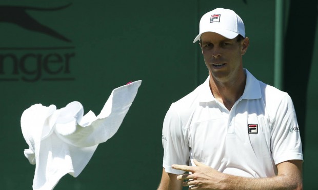 Sam Querrey of the United States throws a towel to a ball boy during the men’s singles first ...