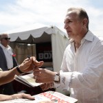 
              International Boxing Hall of Fame inductee, Ray Mancini, signs his autograph for a fan before the start of the International Boxing Hall of Fame Induction ceremony in Canastota, N.Y., Sunday, June 14, 2015. (AP photos/Heather Ainsworth)
            
