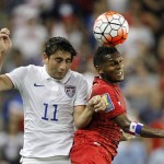
              USA midfielder Alejandro Bedoya (11) and Panama midfielder Alberto Quintero (19) go up for the ball during the first half of a CONCACAF Gold Cup soccer match, Monday, July. 13, 2015, in Kansas City, Kan. (AP Photo/Colin E. Braley)
            