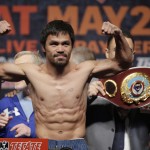               Manny Pacquiao poses during his weigh-in on Friday, May 1, 2015 in Las Vegas. The world weltherweight title fight between Floyd Mayweather Jr. and Pacquiao is scheduled for May 2. (AP Photo/Chris Carlson)
            