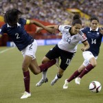 
              Germany's Celia Sasic, center, tries to get by a challenge from France's Wendie Renard, left, as Louisa Necib gives chase during the first half of a FIFA Women's World Cup quarterfinal soccer game, Friday, June 26, 2015, in Montreal, Canada. (Ryan Remiorz/The Canadian Press via AP) MANDATORY CREDIT
            
