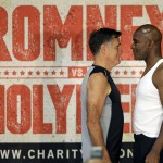 
              Former Republican presidential candidate Mitt Romney, left, and five-time heavyweight boxing champion Evander Holyfield face each other during an official weigh-in Thursday, May 14, 2015, in Holladay, Utah. Romney and Holyfield are set to square off at a charity fight on Friday, May 15, in Salt Lake City. The black-tie event will raise money for the Utah-based organization CharityVision, which helps doctors in developing countries perform surgeries to restore vision in people with curable blindness. (AP Photo/Rick Bowmer)
            