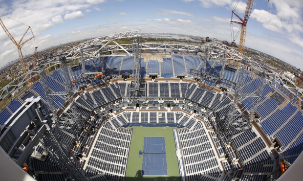 Construction on a roof over Arthur Ashe Stadium continues, Friday, May 1, 2015, at the USTA Billie ...