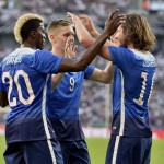 
              United States' scorer Mix Diskerud, right, and his teammates Aron Johannsson, center, and Gyasi Zardes, left, celebrate their side's first goal during the soccer friendly match between Germany and the United States in Cologne, western Germany, Wednesday, June 10, 2015. (AP Photo/Martin Meissner)
            