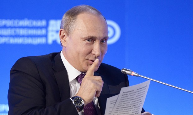 Russian President Vladimir Putin gestures as he speaks at the 10th business forum “Business R...