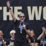 
              U.S. women's soccer team forward Abby Wambach, center, fires up the crowd while celebrating the team's World Cup championship during a public celebration, Tuesday, July 7, 2015, in Los Angeles. This was the first U.S. stop for the team since beating Japan in the Women's World Cup final Sunday in Canada. (AP Photo/Jae C. Hong)
            