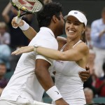
              Leander Paes of India, left, and Martina Hingis of Switzerland celebrate winning the mixed doubles final against Alexander Peya of Austria and Timea Babos of Hungary at the All England Lawn Tennis Championships in Wimbledon, London, Sunday July 12, 2015. (AP Photo/Alastair Grant)
            