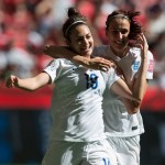 
              England's Jodie Taylor, left, and Jill Scott celebrate Taylor's goal against Canada during the first half of a quarterfinal of the Women's World Cup soccer tournament, Saturday, June 27, 2015, in Vancouver, British Columbia, Canada. (Darryl Dyck/The Canadian Press via AP
            