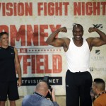 
              Former Republican presidential candidate Mitt Romney, left, looks on as five-time heavyweight boxing champion Evander Holyfield weighs-in Thursday, May 14, 2015, in Holladay, Utah. Romney and Holyfield are set to square off at a charity fight on Friday, May 15, in Salt Lake City. The black-tie event will raise money for the Utah-based organization CharityVision, which helps doctors in developing countries perform surgeries to restore vision in people with curable blindness. (AP Photo/Rick Bowmer)
            