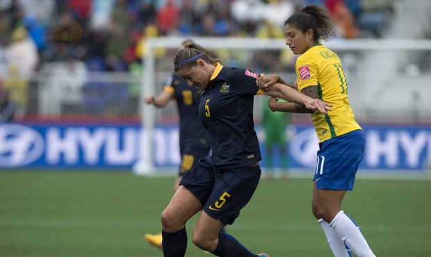 n Australia’s Laura Alleway, left, and Brazil’s Christiane battle for the ball during f...