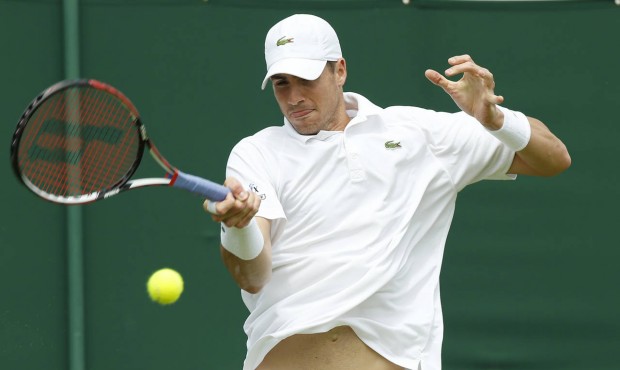 John Isner of the United States returns to Go Soeda of Japan during the men’s singles first r...