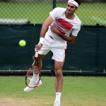 
              Former champion Roger Federer  serves during practice at the Wimbledon Championships at the All England Lawn Tennis and Croquet Club, in  Wimbledon London Sunday June 28, 2015.  The Wimbledon tennis championships begin on Monday. (Adam Davy/PA via AP)
            