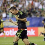 
              Mexico's Jesus Dueñas celebrates after a goal by teammate Jesus Corona during the second half of the CONCACAF Gold Cup championship soccer match against Jamaica, Sunday, July 26, 2015, in Philadelphia. (AP Photo/Matt Rourke)
            
