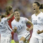 
              United States' Carli Lloyd (10) celebrates with teammates Ali Krieger (11) and Morgan Brian after scoring on a penalty kick against Germany during the second half of a semifinal in the Women's World Cup soccer tournament, Tuesday, June 30, 2015, in Montreal, Canada. (Ryan Remiorz/The Canadian Press via AP)
            