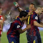 
              Barcelona's Luis Suarez, Adriano Correia and Andres Iniesta, from left to right, celebrate after winning the final of the Copa del Rey soccer match between FC Barcelona and Athletic Bilbao at the Camp Nou stadium in Barcelona, Spain, Saturday, May 30, 2015. (AP Photo/Manu Fernandez)
            