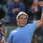 
              Spain's Rafael Nadal celebrates winning the fourth round match of the French Open tennis tournament against Jack Sock of the U.S. in four sets 6-3, 6-1, 5-7, 6-2, at the Roland Garros stadium, in Paris, France, Monday, June 1, 2015. (AP Photo/Thibault Camus)
            