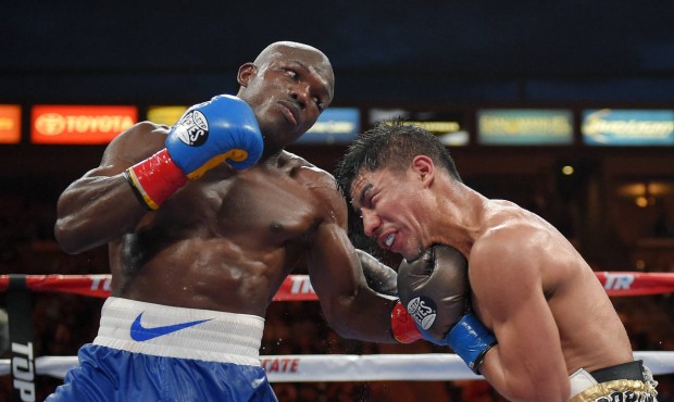 Timothy Bradley, left, connects with Jessie Vargas during a welterweight boxing match for the inter...