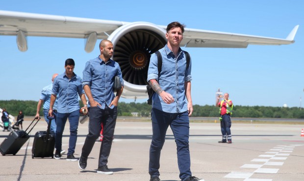 In this image provided by UEFA Barcelona’s Lionel Messi, right, Javier Mascherano and Luis Su...