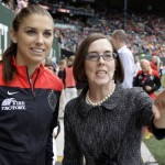 
              Portland Thorns forward Alex Morgan, left, is joined by Oregon Gov. Kate Brown before the Thorns' NWSL soccer match against the Seattle Reign in Portland, Ore., Wednesday, July 22, 2015.  Morgan did not play because she is recovering from knee surgery. (AP Photo/Don Ryan)
            