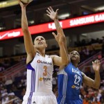 Phoenix Mercury's Diana Taurasi (3) scores as she gets past Minnesota Lynx's Monica Wright (22) during the second half in a WNBA Western Conference Finals basketball game on Sunday, Sept. 29, 2013, in Phoenix. The Lynx defeated the Mercury 72-65 and won the Western Conference Finals 2-0, earning a trip to the WNBA Finals to face the Atlanta Dream. (AP Photo/Ross D. Franklin)