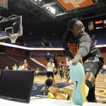 East's Tina Charles, of the New York Liberty, stretches before the WNBA All-Star basketball game against the West, Saturday, July 25, 2015, in Uncasville, Conn. (AP Photo/Jessica Hill)
