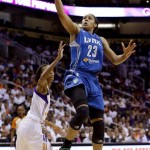 Minnesota Lynx's Maya Moore (23) scores as she gets past Phoenix Mercury's DeWanna Bonner, left, during the second half in a WNBA Western Conference Finals basketball game on Sunday, Sept. 29, 2013, in Phoenix. The Lynx defeated the Mercury 72-65 and won the Western Conference Finals 2-0, earning a trip to the WNBA Finals to face the Atlanta Dream. (AP Photo/Ross D. Franklin)