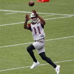 Arizona Cardinals' Larry Fitzgerald makes a catch during practice at NFL football training camp on Friday, July 26, 2013, in Glendale, Ariz. (AP Photo/Matt York)