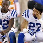 Indianapolis Colts' Josh Gordy (27) and Cassius Vaughn (32) sit on the bench during the second half of an NFL football game against the Arizona Cardinals Sunday, Nov. 24, 2013, in Glendale, Ariz. The Cardinals defeated the Colts 40-11. (AP Photo/Ross D. Franklin)