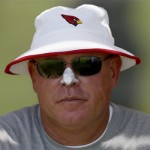 Arizona Cardinals head coach Bruce Arians sits on the sidelines after an NFL football minicamp Thursday morning, June 13, 2013, in Tempe, Ariz. (AP Photo/Ross D. Franklin)