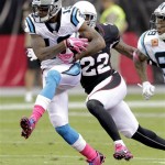 Carolina Panthers wide receiver Ted Ginn (19) tries to break away from Arizona Cardinals defensive back Tony Jefferson (22) during the first half of a NFL football game, Sunday, Oct. 6, 2013, in Glendale, Ariz. (AP Photo/Rick Scuteri)