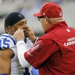 Arizona Cardinals head coach Bruce Arians, right, pinches the cheeks of Indianapolis Colts wide receiver LaVon Brazill (15) prior to an NFL football game, Sunday, Nov. 24, 2013, in Glendale, Ariz. (AP Photo/Matt York)