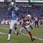 Tennessee Titans wide receiver Michael Preston (14) catches a 10-yard pass for a touchdown as he is defended by Arizona Cardinals cornerback Antoine Cason (20) in the fourth quarter of an NFL football game Sunday, Dec. 15, 2013, in Nashville, Tenn. (AP Photo/Wade Payne)