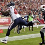 Houston Texans wide receiver Andre Johnson, left, makes a touchdown catch as Arizona Cardinals cornerback Patrick Peterson defends during the first half of an NFL football game Sunday, Nov. 10, 2013, in Glendale, Ariz. (AP Photo/Ross D. Franklin)