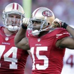 San Francisco 49ers wide receiver Michael Crabtree (15) celebrates with offensive tackle Joe Staley (74) after making a reception against the Arizona Cardinals during the second half of an NFL football game in San Francisco, Sunday, Dec. 30, 2012. (AP Photo/Tony Avelar)
