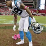 Carolina Panthers wide receiver Steve Smith (89) leaves his pink cleats at midfield after an NFL football game against the Arizona Cardinals, Sunday, Oct. 6, 2013, in Glendale, Ariz. The Cardinals won 22-6. (AP Photo/Rick Scuteri)