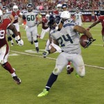 Seattle Seahawks running back Marshawn Lynch (24) tries to avoid Arizona Cardinals inside linebacker Daryl Washington (58) during the second half of an NFL football game, Thursday, Oct. 17, 2013, in Glendale, Ariz. (AP Photo/Ross D. Franklin)