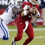 Arizona Cardinals' Carson Palmer, right, gets sacked by Indianapolis Colts' Ricky Jean Francois during the first half of an NFL football game Sunday, Nov. 24, 2013, in Glendale, Ariz. (AP Photo/Ross D. Franklin)