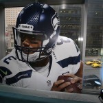 A window sticker of Seattle Seahawks quarterback Russell Wilson overlooks 7th Avenue from the NFL Super Bowl XLVIII media center, Monday, Jan. 27, 2014, in New York. The NFL's championship game between the Denver Broncos and Seattle Seahawks is scheduled for Sunday, Feb. 3 in East Rutherford, N.J. (AP Photo/Matt Slocum)