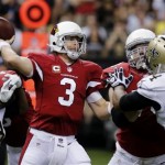 Arizona Cardinals quarterback Carson Palmer (3) passes as New Orleans Saints defensive end Cameron Jordan (94) and outside linebacker Junior Galette (93) pressure him in the first half of an NFL football game in New Orleans, Sunday, Sept. 22, 2013. (AP Photo/Bill Haber)