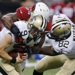New Orleans Saints quarterback Drew Brees (9) is sacked by Arizona Cardinals outside linebacker Sam Acho as Saints tight end Benjamin Watson (82) tries to block in the first half of an NFL football game in New Orleans, Sunday, Sept. 22, 2013. (AP Photo/Bill Haber)