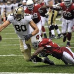 New Orleans Saints tight end Jimmy Graham (80) reaches over the goal line on a touchdown reception over Arizona Cardinals cornerback Patrick Peterson (21) in the second half of an NFL football game in New Orleans, Sunday, Sept. 22, 2013.(AP Photo/Bill Feig)