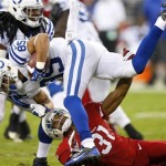 Indianapolis Colts' David Reed (85) is tackled by Arizona Cardinals cornerback Justin Bethel (31) during the first half of an NFL football game, Sunday, Nov. 24, 2013, in Glendale, Ariz. (AP Photo/Rick Scuteri)
