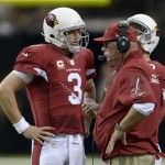 Arizona Cardinals head coach Bruce Arians, right, talks to quarterback Carson Palmer (3) in the first half of an NFL football game against the New Orleans Saintsin New Orleans, Sunday, Sept. 22, 2013. (AP Photo/Bill Feig)