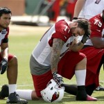 Arizona Cardinals' Rob Housler (84), Daryn Colledge (71), and Levi Brown (75) take a break on the sidelines during NFL football minicamp Thursday morning, June 13, 2013, in Tempe, Ariz. (AP Photo/Ross D. Franklin)