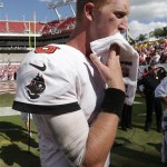 Tampa Bay Buccaneers quarterback Mike Glennon (8) wipes his face as he leaves the field following the team's 13-10 loss to the Arizona Cardinals in an NFL football game on Sunday, Sept. 29, 2013, in Tampa, Fla. (AP Photo/Chris O'Meara)