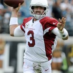 Arizona Cardinals quarterback Carson Palmer (3) throws a pass as he is pressured by the Jacksonville Jaguars defense during the first half of an NFL football game in Jacksonville, Fla., Sunday, Nov. 17, 2013. (AP Photo/Stephen Morton)