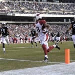 Arizona Cardinals' Larry Fitzgerald scores a touchdown during the first half of an NFL football game against the Philadelphia Eagles, Sunday, Dec. 1, 2013, in Philadelphia. (AP Photo/Michael Perez)