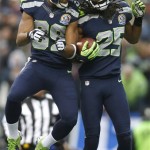 Seattle Seahawks cornerback Richard Sherman (25) celebrates with wide receiver Doug Baldwin (89) after returning an interception from Arizona Cardinals quarterback John Skelton for a 19-yard touchdown during the second quarter of an NFL football game in Seattle, Sunday, Dec. 9, 2012. (AP Photo/John Froschauer)
