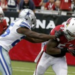 Arizona Cardinals' Jasper Brinkley, right, recovers a fumble by Dallas Cowboys' Lance Dunbar, left, as Cardinals' Patrick Peterson, back left, looks on in the first half of a preseason NFL football game on Saturday, Aug. 17, 2013, in Glendale, Ariz. (AP Photo/Ross D. Franklin)